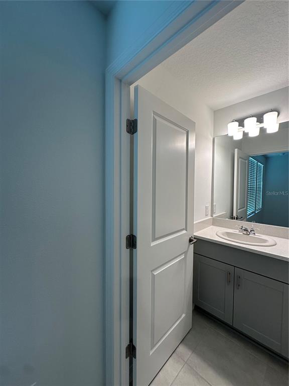 3137 Skyline Loop Kissimmee, FL 34758 - Photo 12 of 14 a bathroom with a double vanity sink mirror and double
