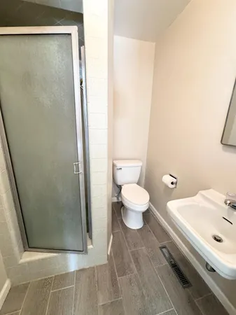 a view of a kitchen with a sink refrigerator and a window