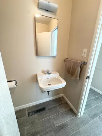 a kitchen with a sink and refrigerator
