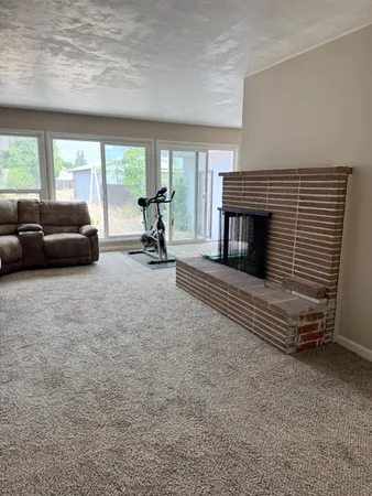an empty room with a empty space and windows