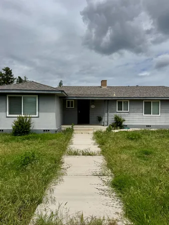 front view of a house with a yard
