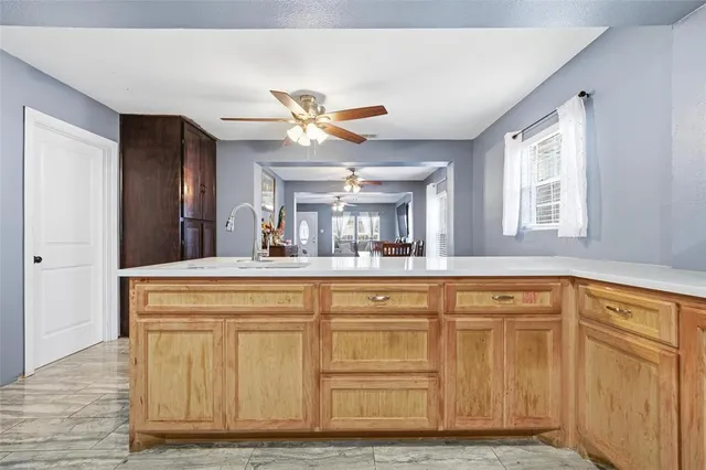a spacious bathroom with a sink a mirror and a shower
