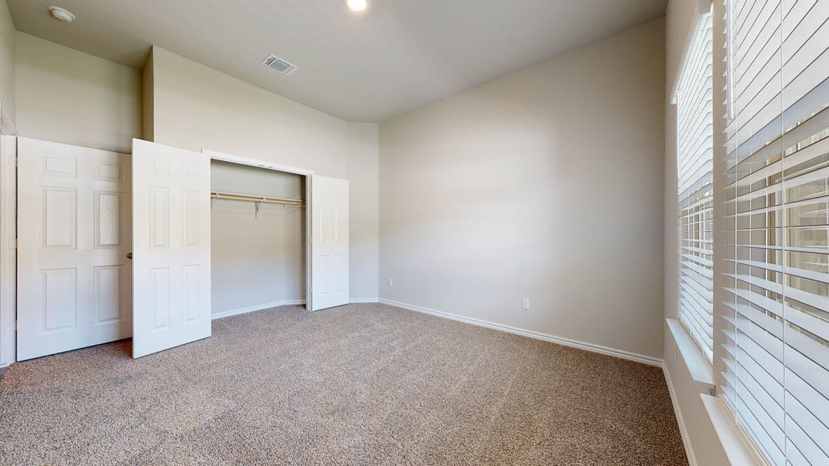 104 Kenzie Street Thorndale, TX 76577 - Photo 24 of 28 an empty room with windows