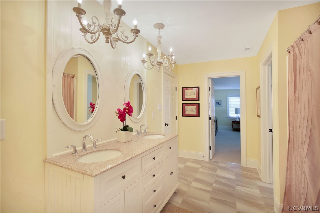 3606 Bircham Loop Midlothian, VA 23113 - Photo 17 of 24 a bathroom with a sink and a mirror