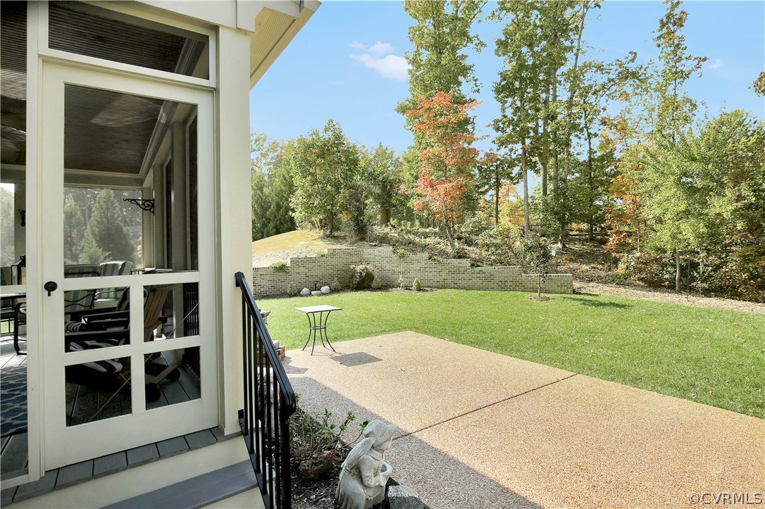 3606 Bircham Loop Midlothian, VA 23113 - Photo 22 of 24 a view of a backyard with table and chairs and wooden fence