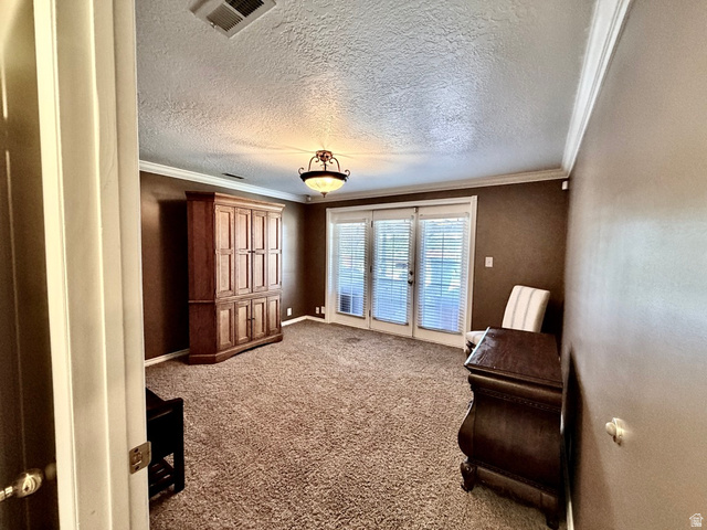 12080 Mill Ridge Circle Sandy, UT 84094 - Photo 25 of 56 Spacious interior room featuring French doors with integrated blinds, crown molding, and textured ceilings