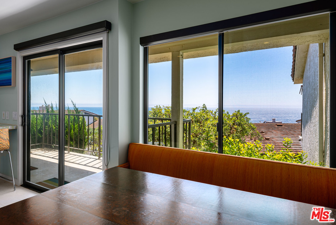 6789 Shearwater Lane Malibu, CA 90265 - Photo 4 of 21 a view of a glass door with a from a window