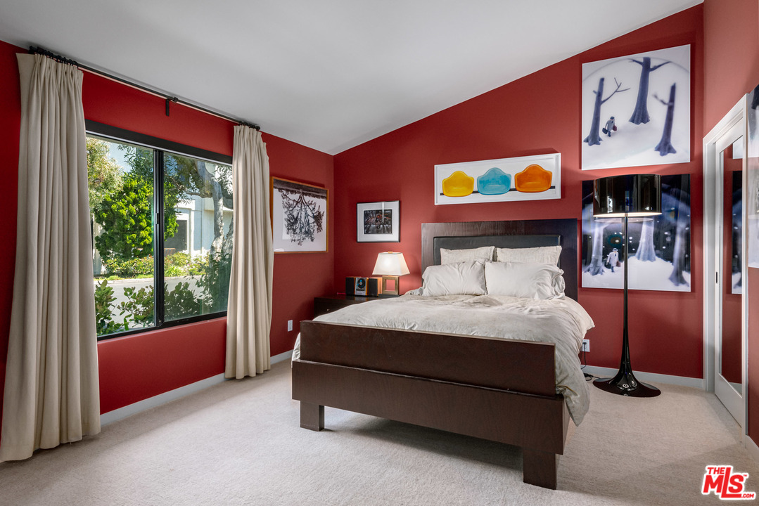 6789 Shearwater Lane Malibu, CA 90265 - Photo 6 of 21 a bedroom with a bed and glass window