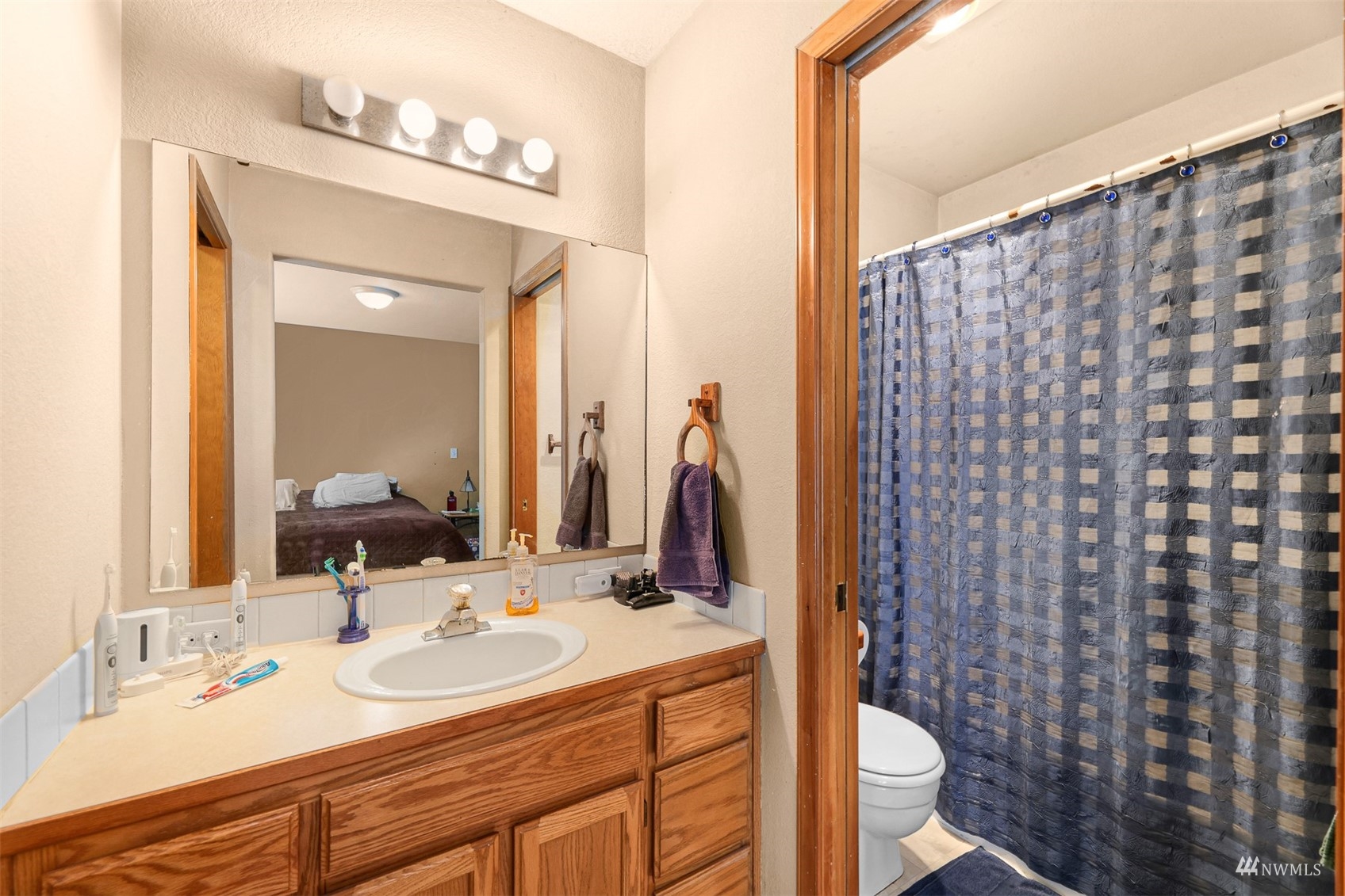 1341 Roma Road Bellingham, WA 98226 - Photo 16 of 40 a bathroom with a double vanity sink and a mirror