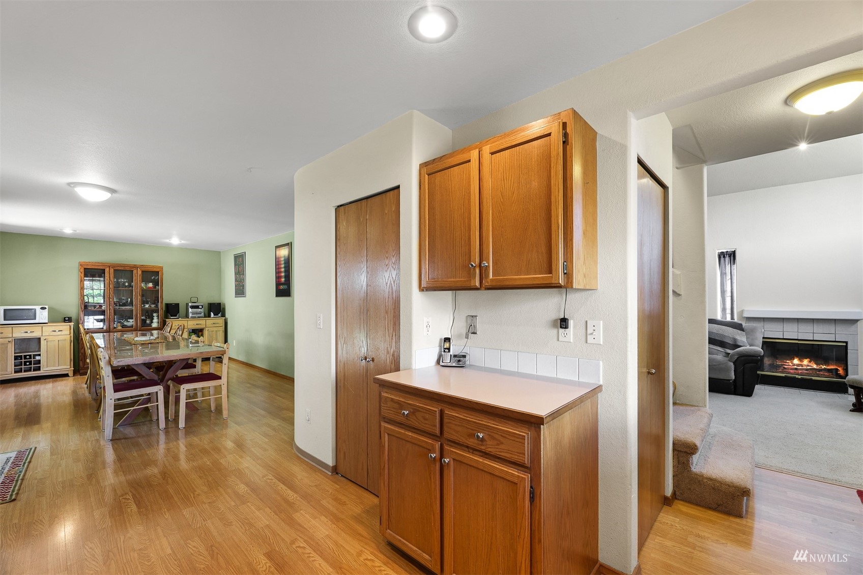 1341 Roma Road Bellingham, WA 98226 - Photo 27 of 40 a kitchen with granite countertop a refrigerator cabinets and wooden floor