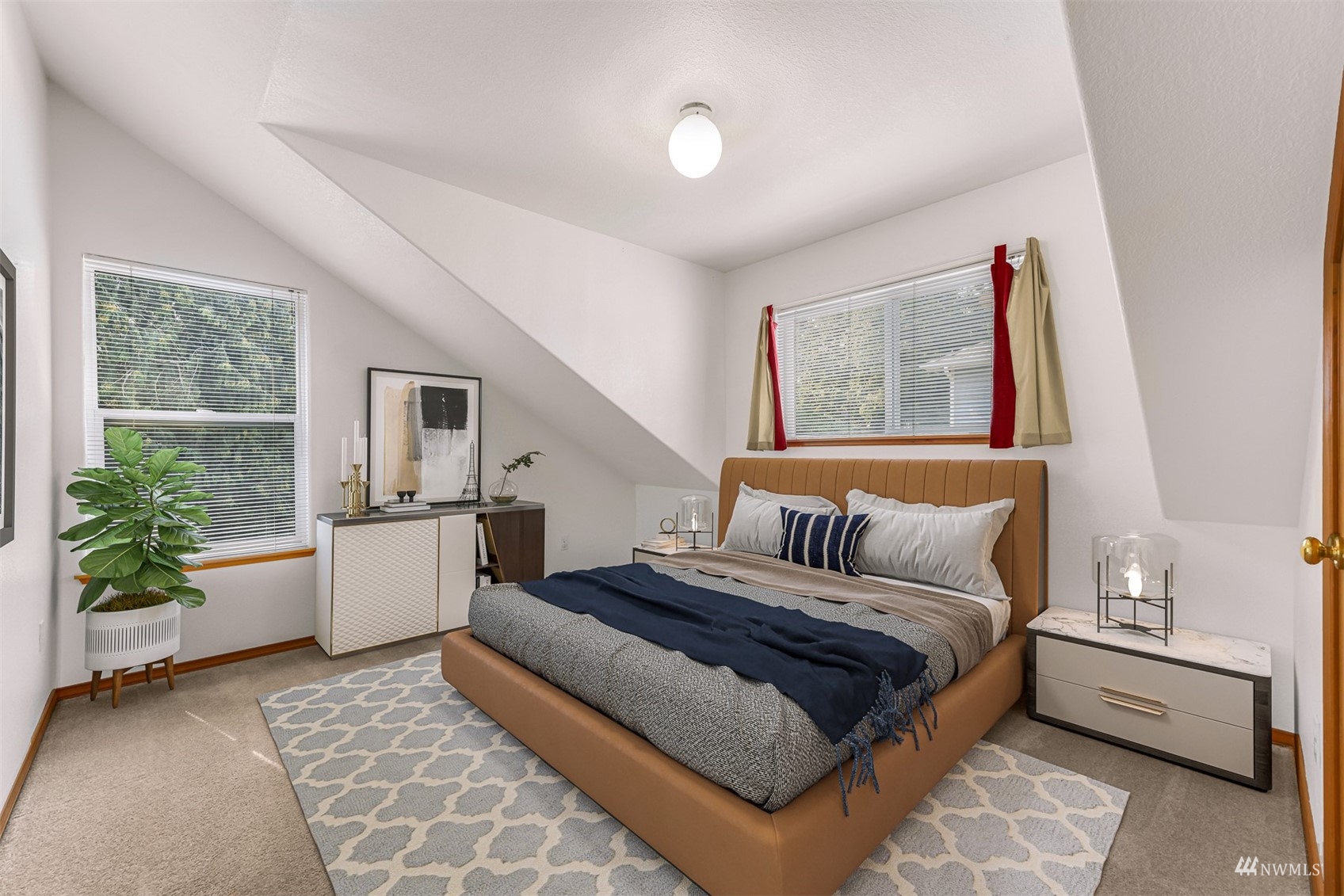 1341 Roma Road Bellingham, WA 98226 - Photo 30 of 40 a bedroom with a large bed and a couch