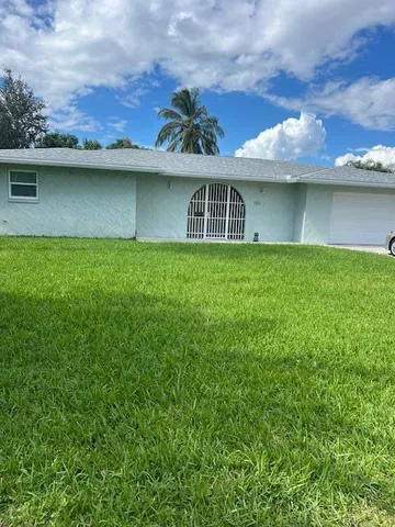 a view of a house with a garden