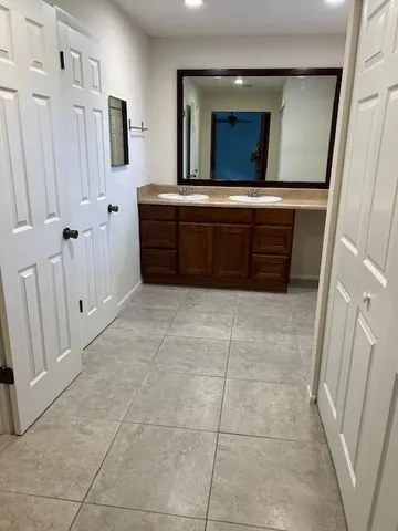 a bathroom with a sink and mirror
