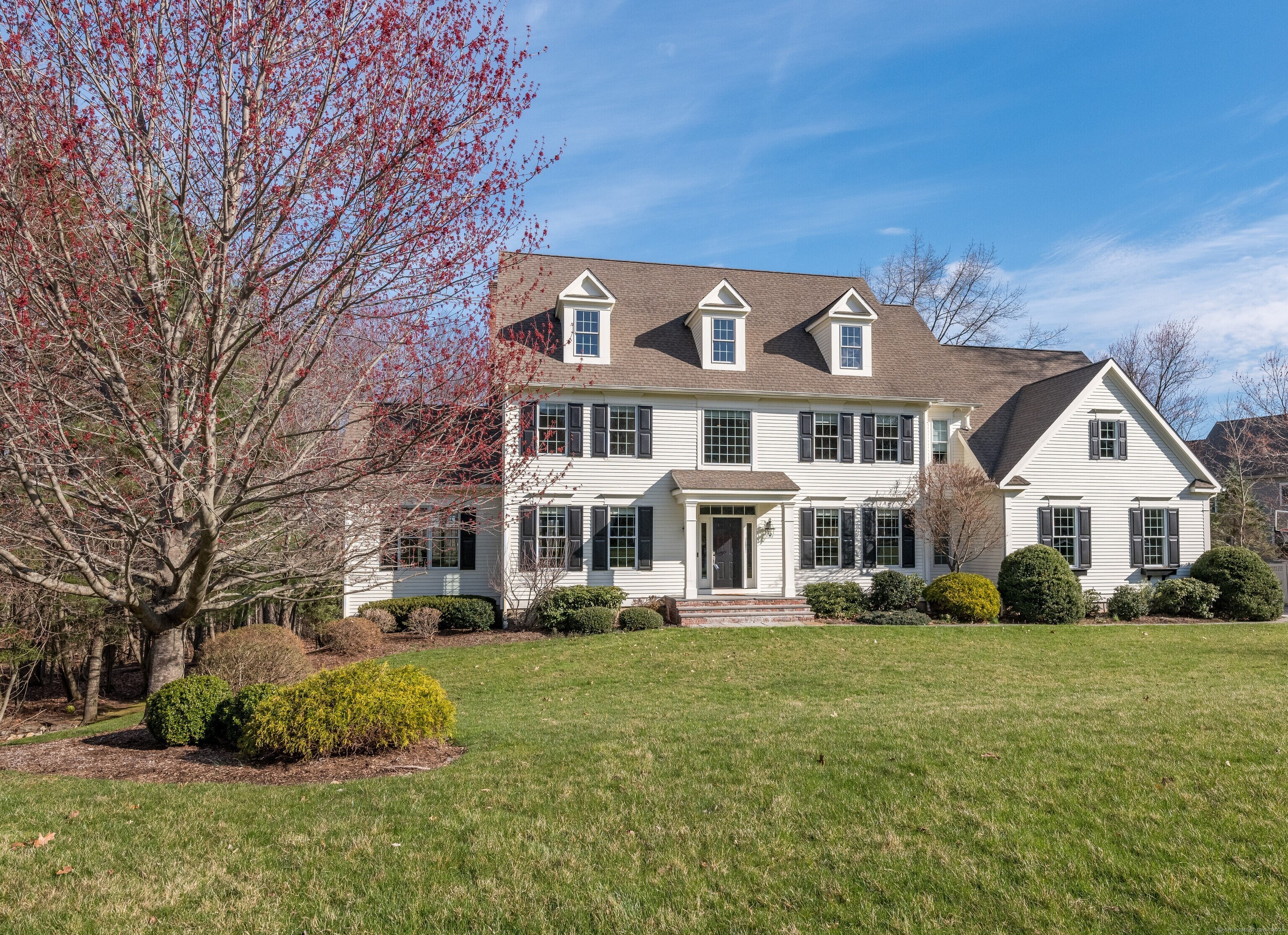 15 Bart Drive Canton, CT 06019 - Photo 1 of 1 a front view of a house with a garden