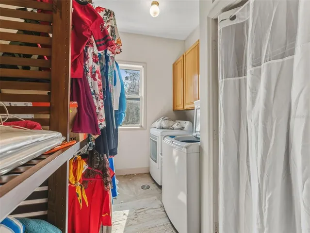 a view of a kitchen with furniture and a window