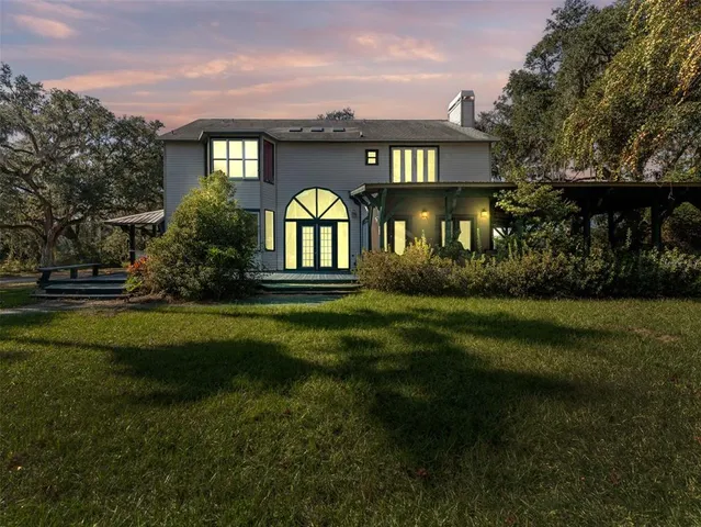 a view of a city with lush green forest