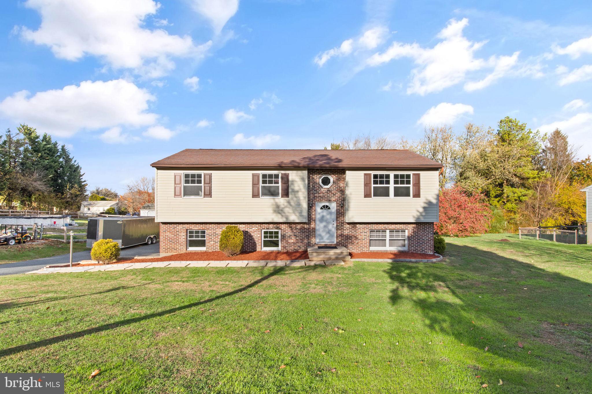 148 Sharon Street Rising Sun, MD 21911 - Photo 1 of 43 a view of a house with a big yard and large trees
