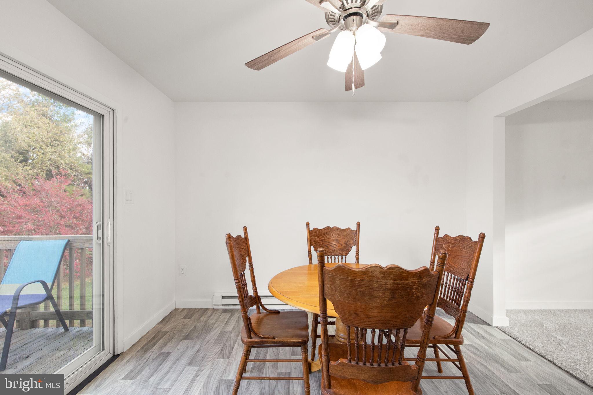 148 Sharon Street Rising Sun, MD 21911 - Photo 16 of 43 a view of a dining room with furniture wooden floor and chandelier