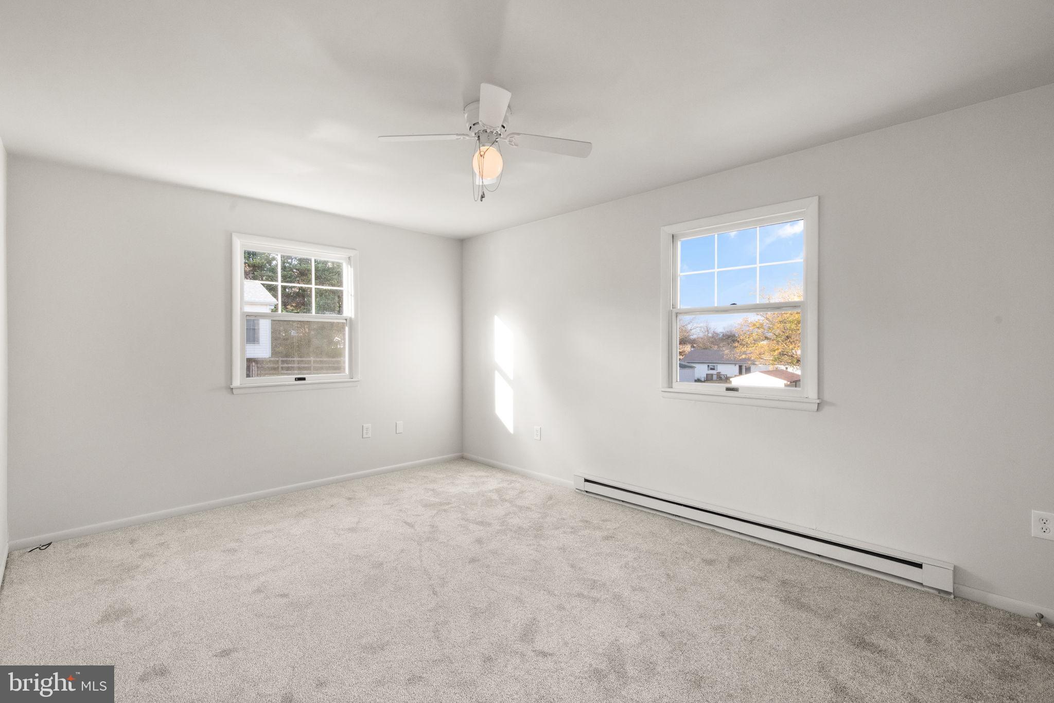 148 Sharon Street Rising Sun, MD 21911 - Photo 20 of 43 an empty room with windows and fan