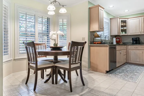 a dining room with furniture and window