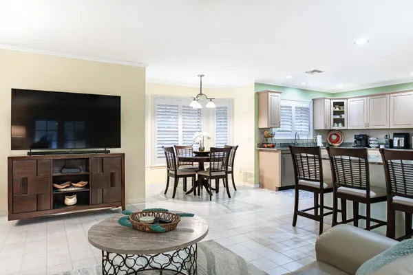 a dining room with furniture and wooden floor