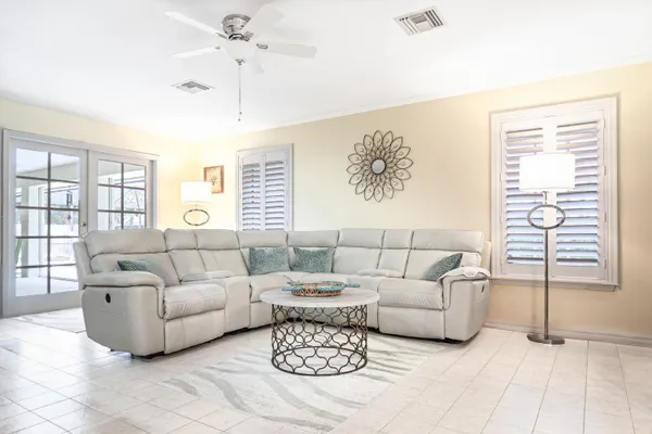 a living room with furniture and a large window