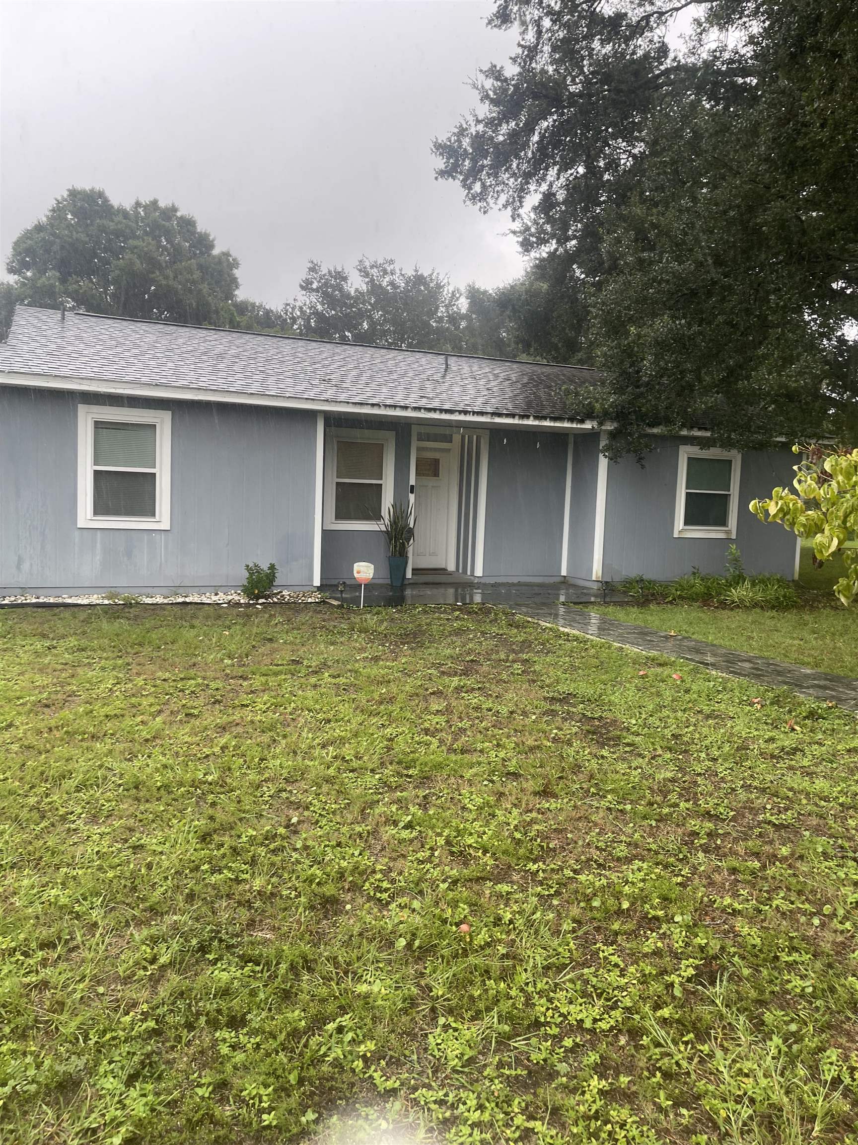 a house view with a garden space