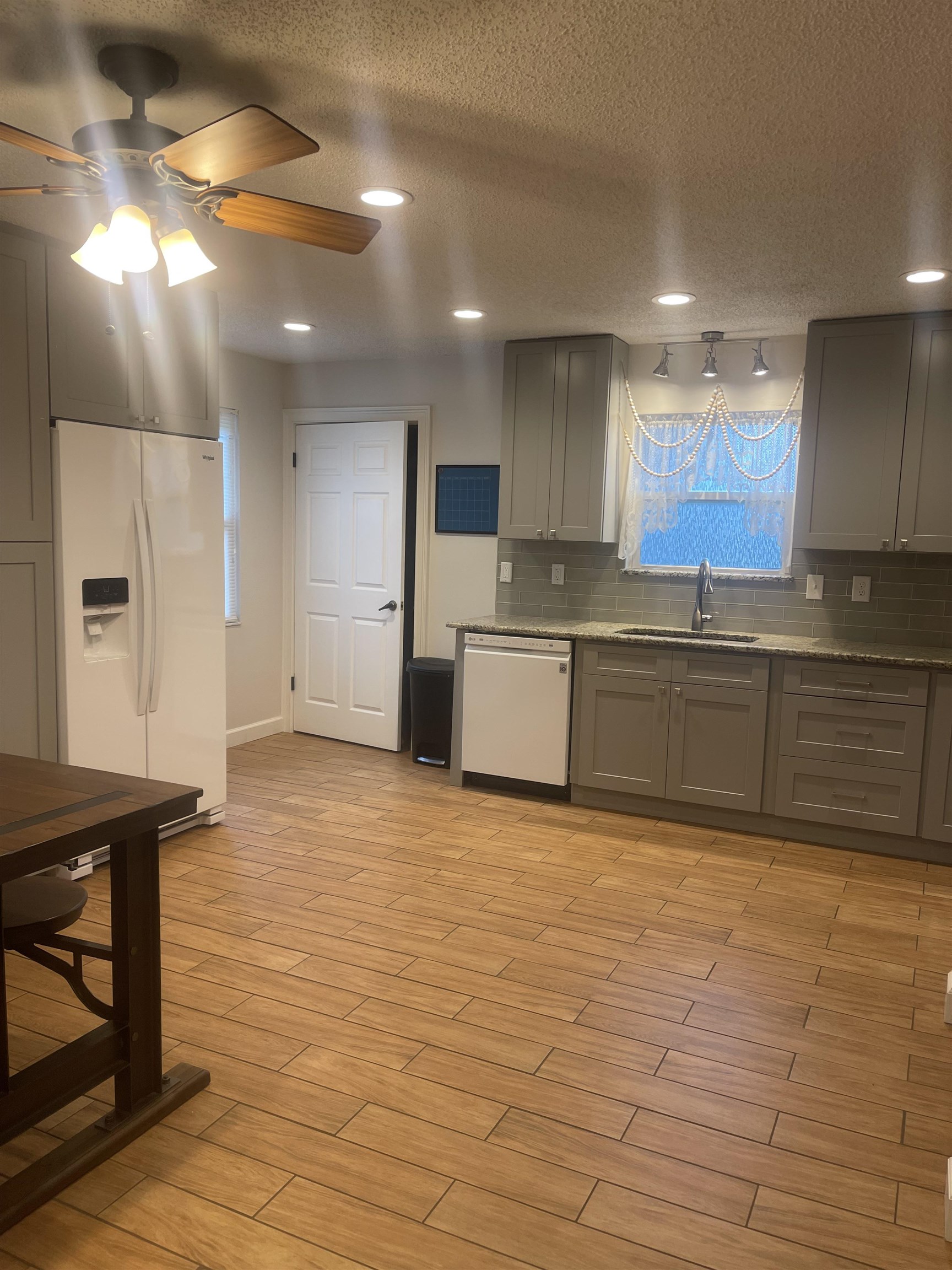 2928 Del Rio Drive St. Augustine, FL 32084 - Photo 2 of 18 a large kitchen with stainless steel appliances granite countertop a sink and cabinets