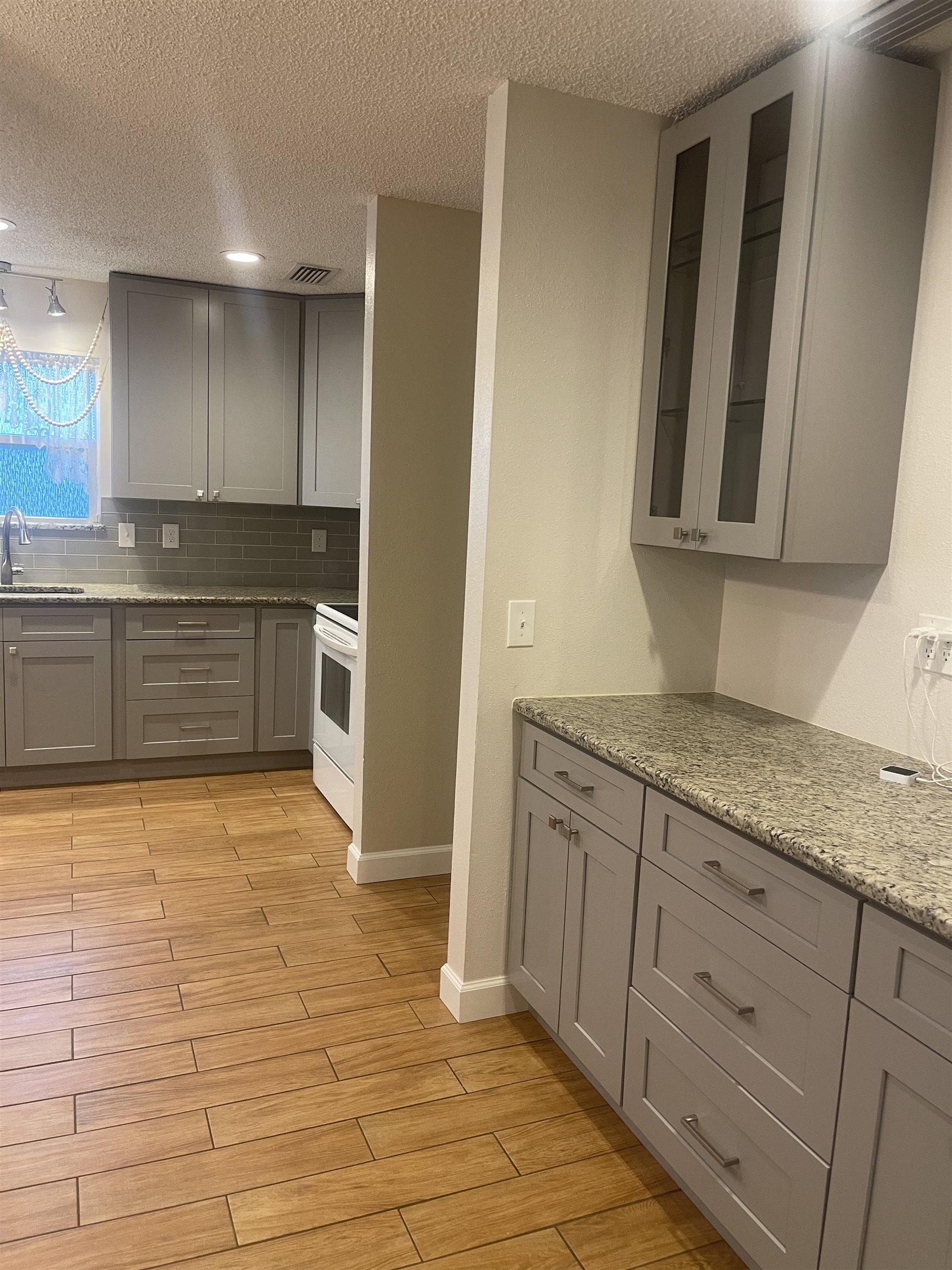 2928 Del Rio Drive St. Augustine, FL 32084 - Photo 4 of 18 a kitchen with stainless steel appliances granite countertop a sink and cabinets