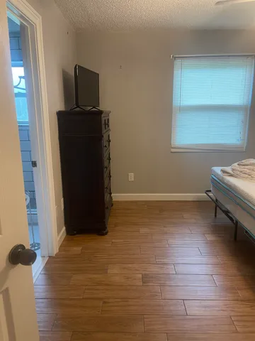 a view of a hardwood & utility room