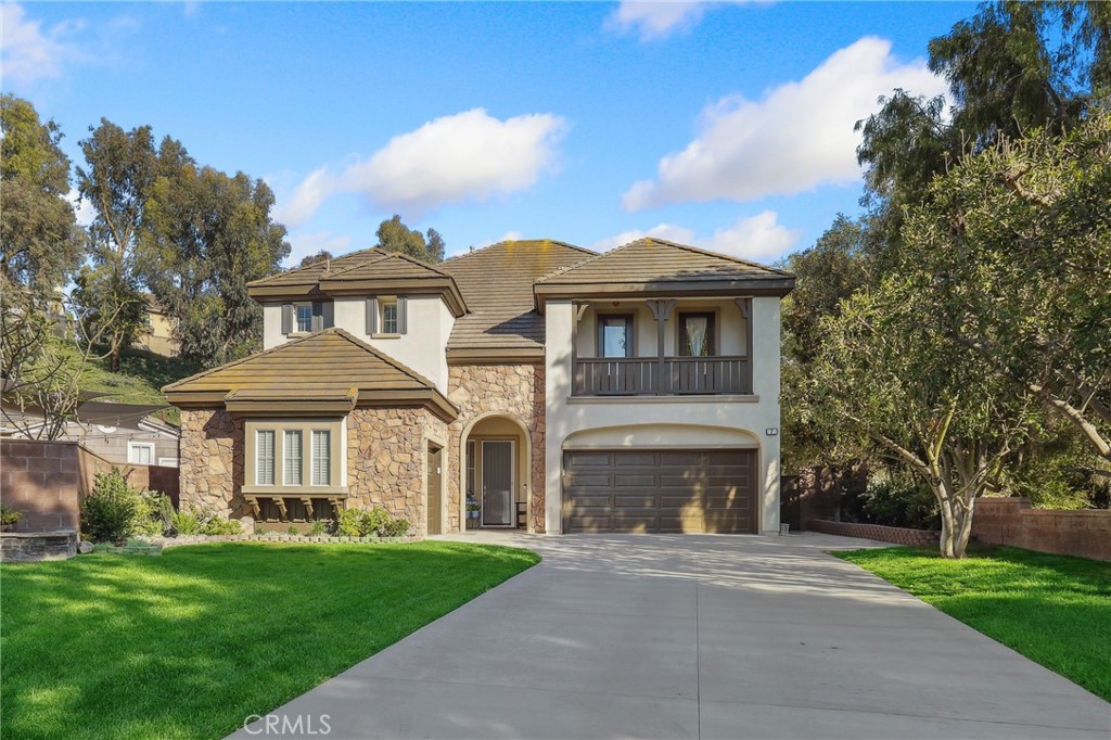 7 Wegeford Circle Ladera Ranch, CA 92694 - Photo 1 of 74 a front view of a house with a garden