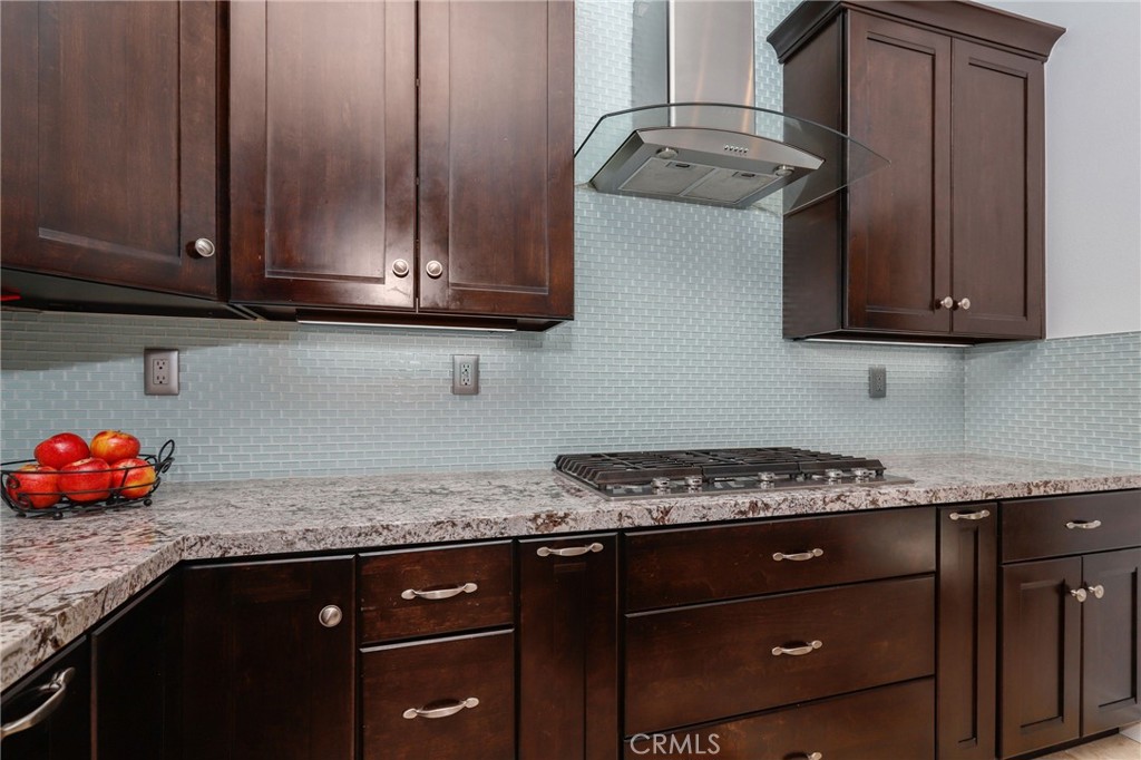 7 Wegeford Circle Ladera Ranch, CA 92694 - Photo 20 of 74 a kitchen with stainless steel appliances granite countertop a sink stove and cabinets