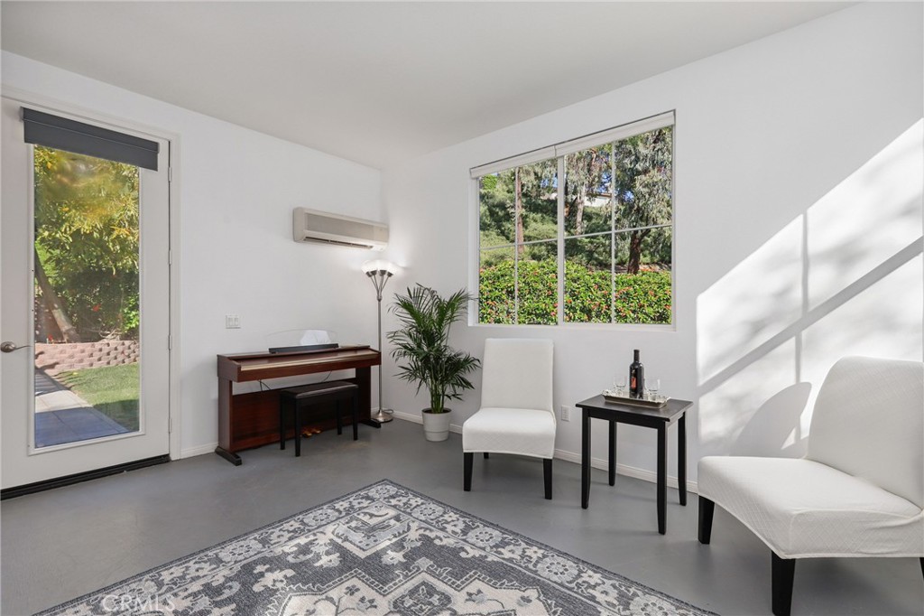 7 Wegeford Circle Ladera Ranch, CA 92694 - Photo 24 of 74 a living room with furniture and a window