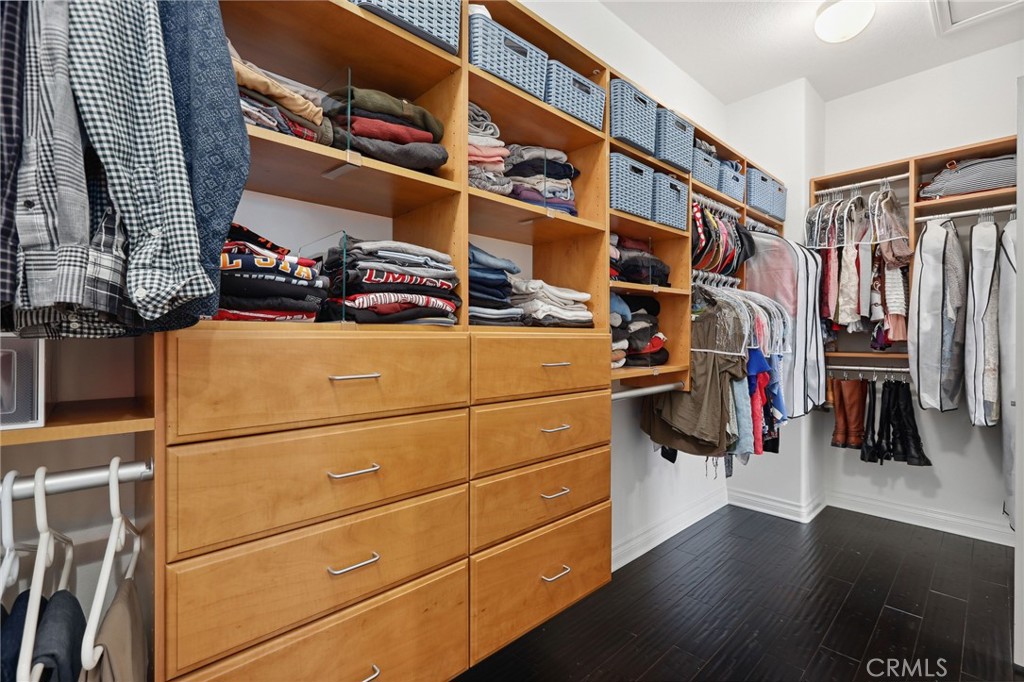 7 Wegeford Circle Ladera Ranch, CA 92694 - Photo 30 of 74 a view of walk in closet with clothes and shoes