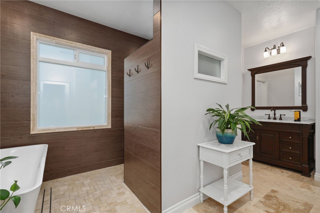 7 Wegeford Circle Ladera Ranch, CA 92694 - Photo 32 of 74 a bathroom with a sink and a mirror