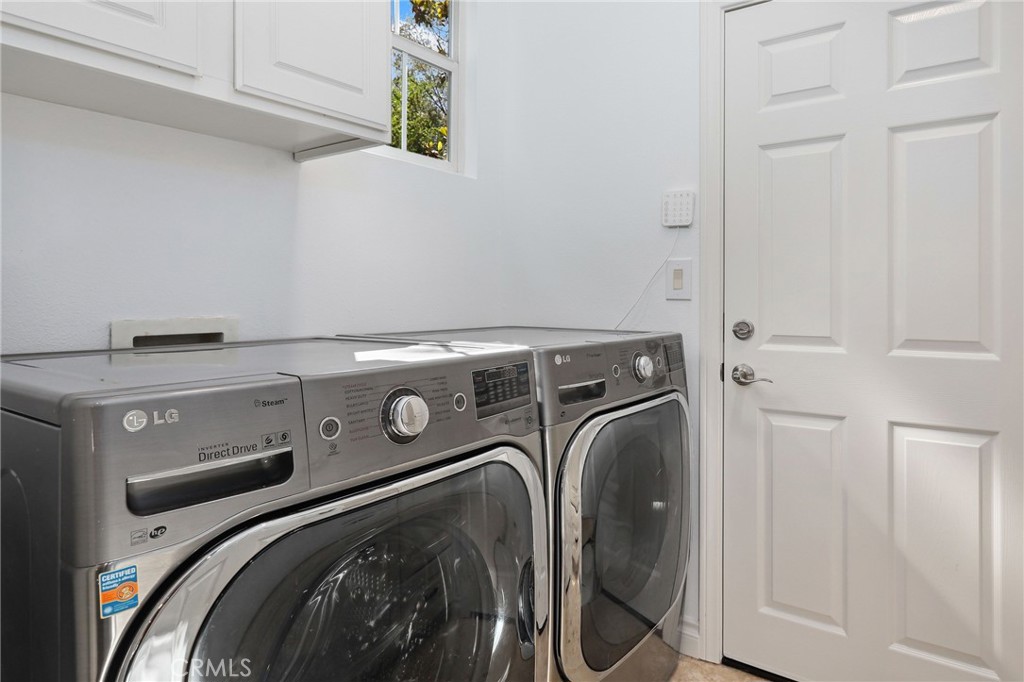 7 Wegeford Circle Ladera Ranch, CA 92694 - Photo 42 of 74 a utility room with dryer and washer