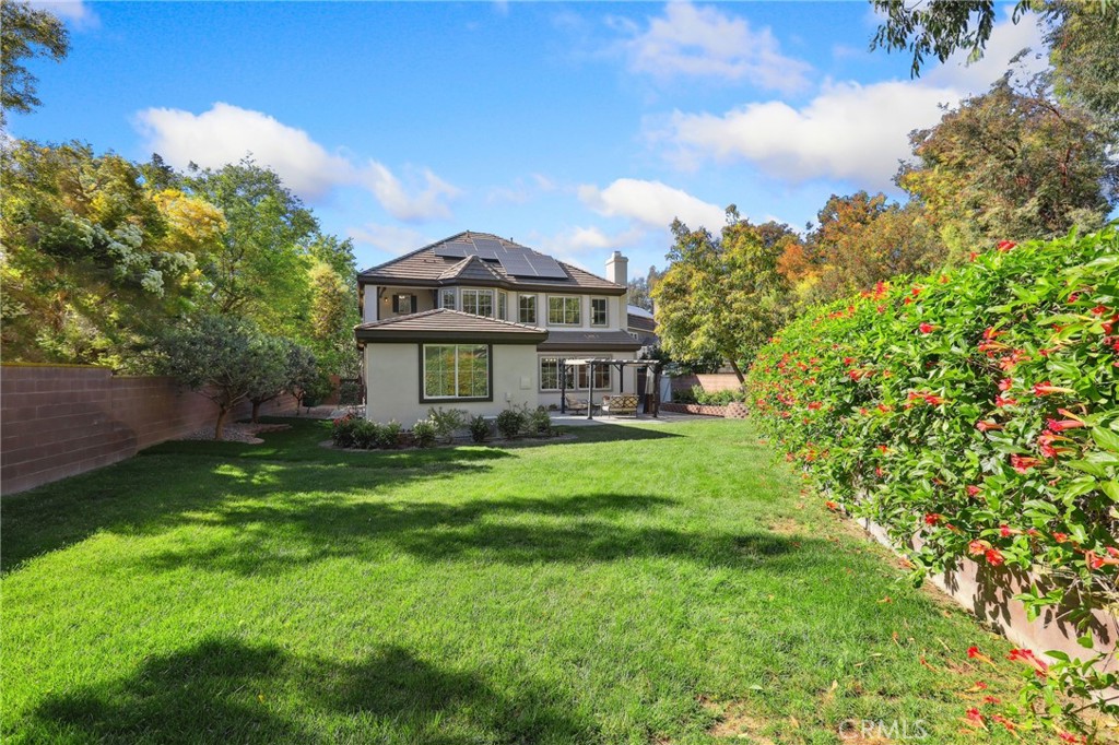 7 Wegeford Circle Ladera Ranch, CA 92694 - Photo 52 of 74 a front view of a house with a yard