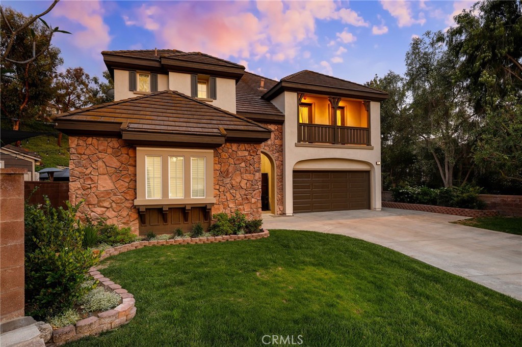 7 Wegeford Circle Ladera Ranch, CA 92694 - Photo 68 of 74 a front view of a house with a garden and yard