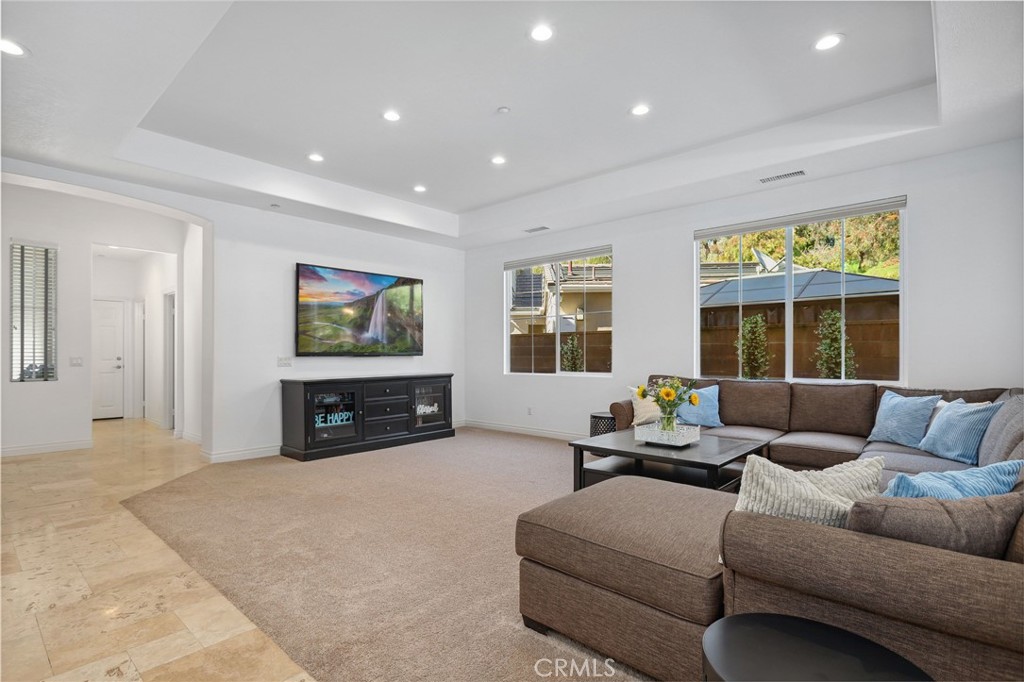 7 Wegeford Circle Ladera Ranch, CA 92694 - Photo 7 of 74 a living room with furniture and a flat screen tv
