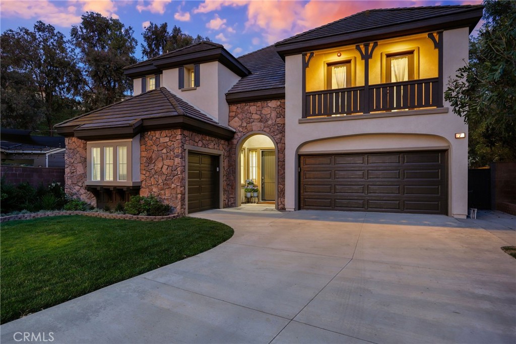 7 Wegeford Circle Ladera Ranch, CA 92694 - Photo 73 of 74 a front view of a house with a yard and garage