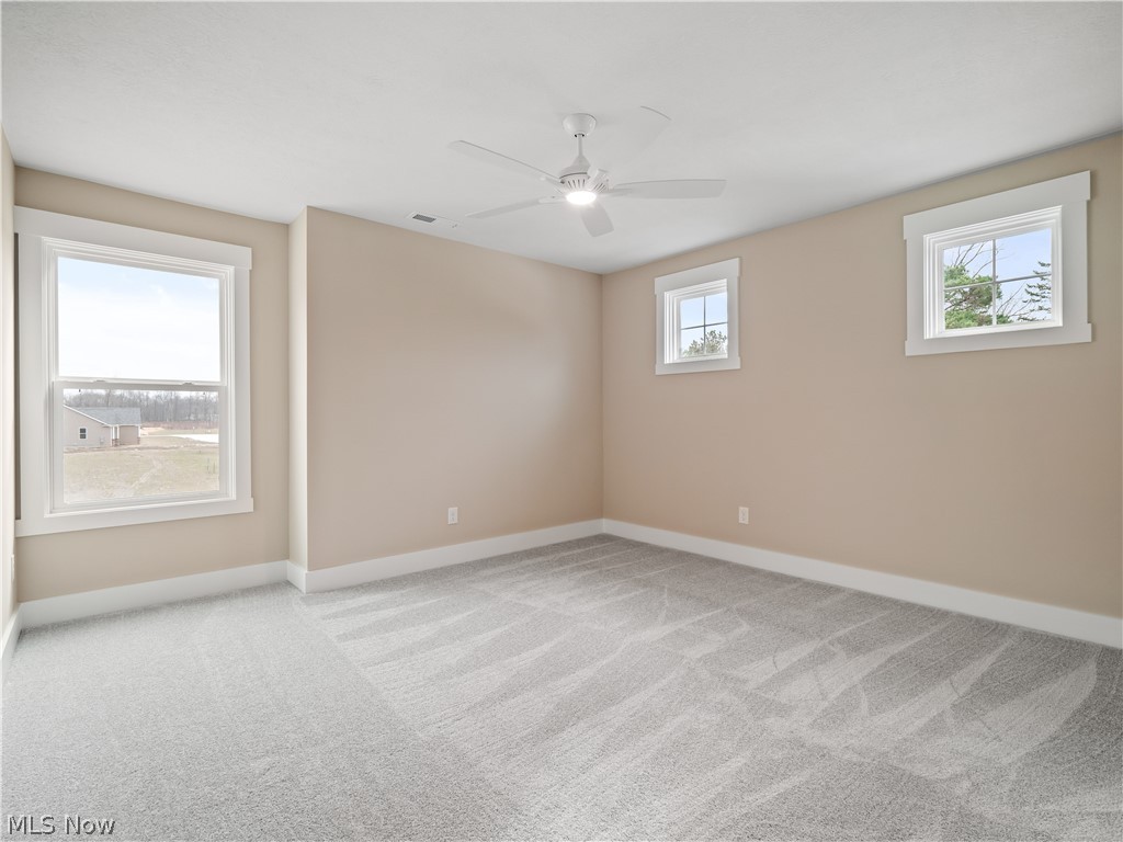 34270 Brookside Lane North Ridgeville, OH 44039 - Photo 36 of 50 Spare room with light carpet and a ceiling fan