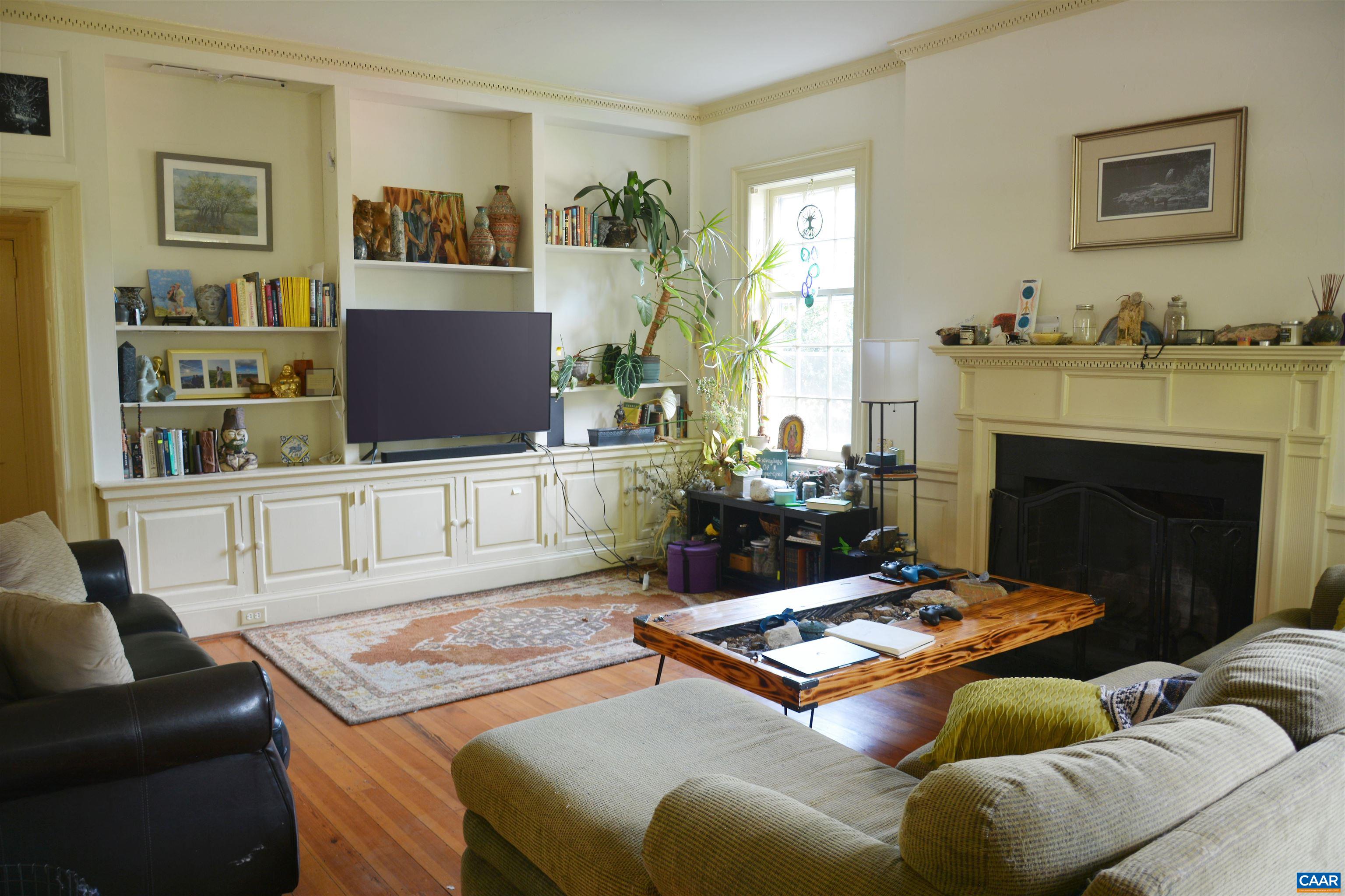 2003 Lewis Mountain Road Charlottesville, VA 22903 - Photo 5 of 19 a living room with furniture and a fireplace