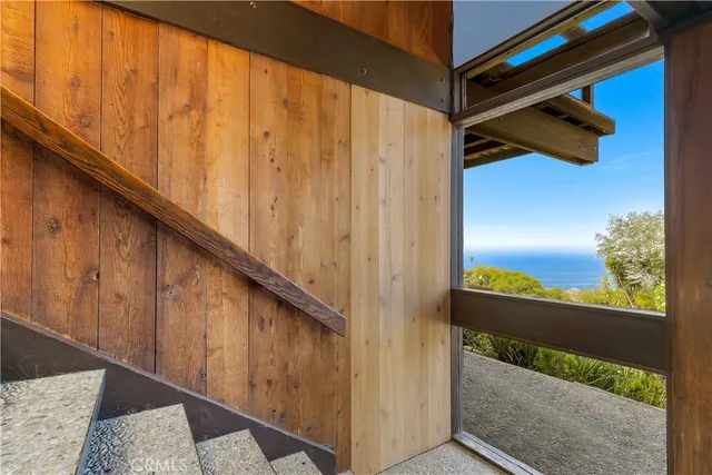 a view of a balcony with wooden floor