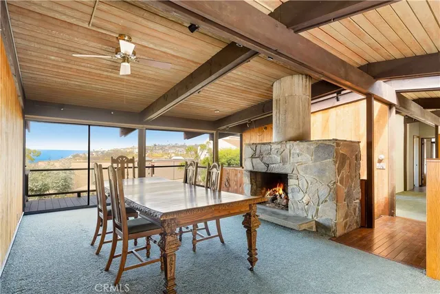 a dining room with furniture and a fireplace