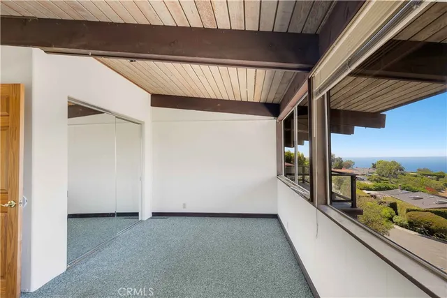 a bathroom with a toilet and a shower curtain