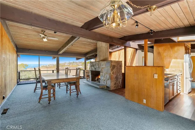 a dining room with furniture and a chandelier