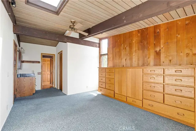 a view of a backyard with sitting area