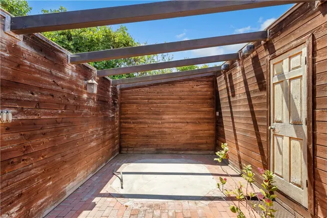 a living room with furniture and large window