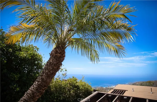 a view of a living room with furniture and a floor to ceiling window