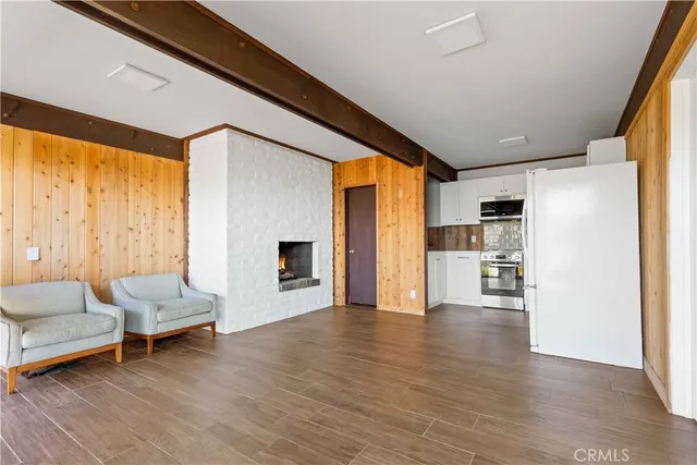 a bathroom with a granite countertop toilet and a sink